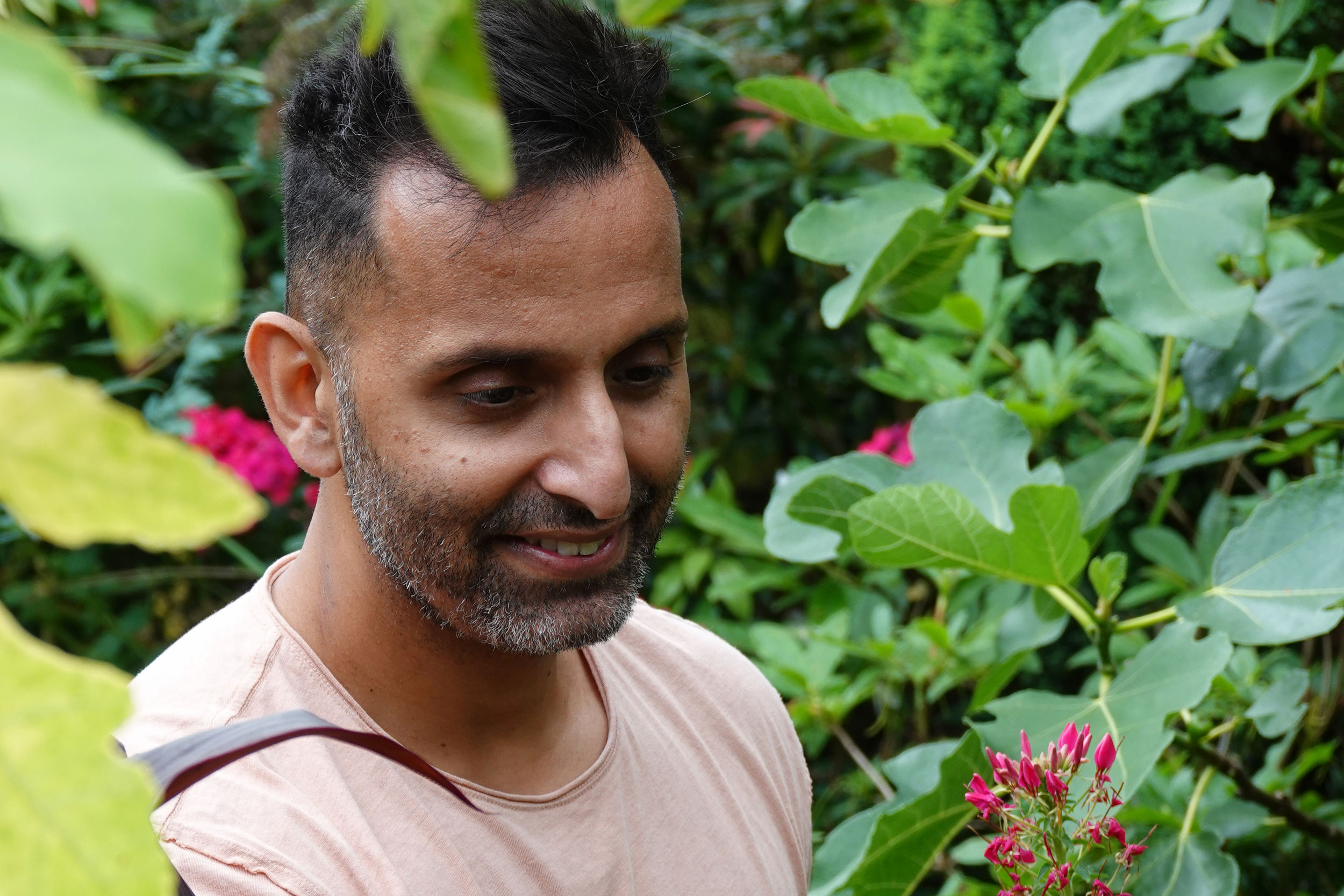 Amir tending his plants.