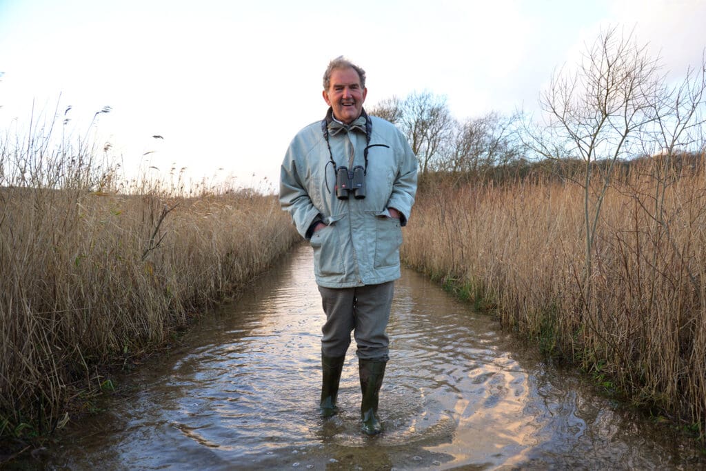 David Hindle stands in the water at Leighton Moss