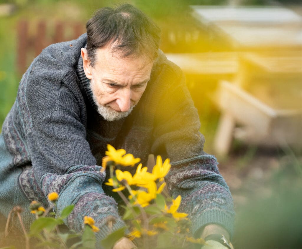 Ken tends one of the flower beds. He is one of about 25 regular volunteers