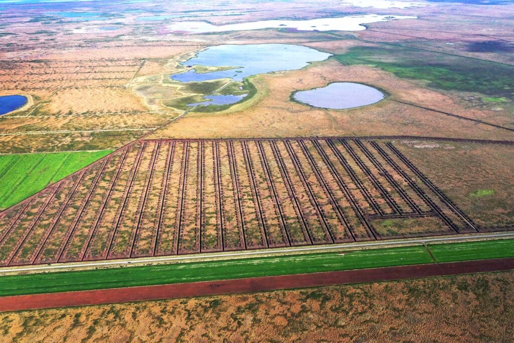 An aerial view of a patchwork of fields and wetlands in Iceland