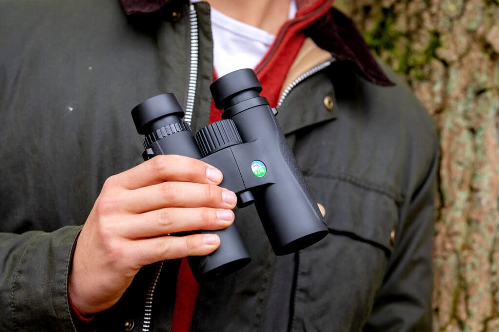 RSPB Skylark binoculars held in someone's hand