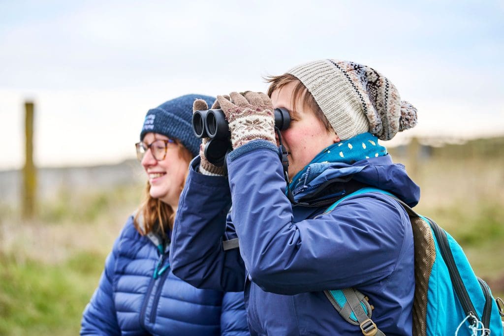 Women with binoculars.