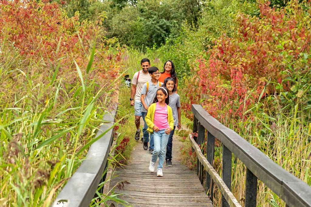 A family walking over a bridge