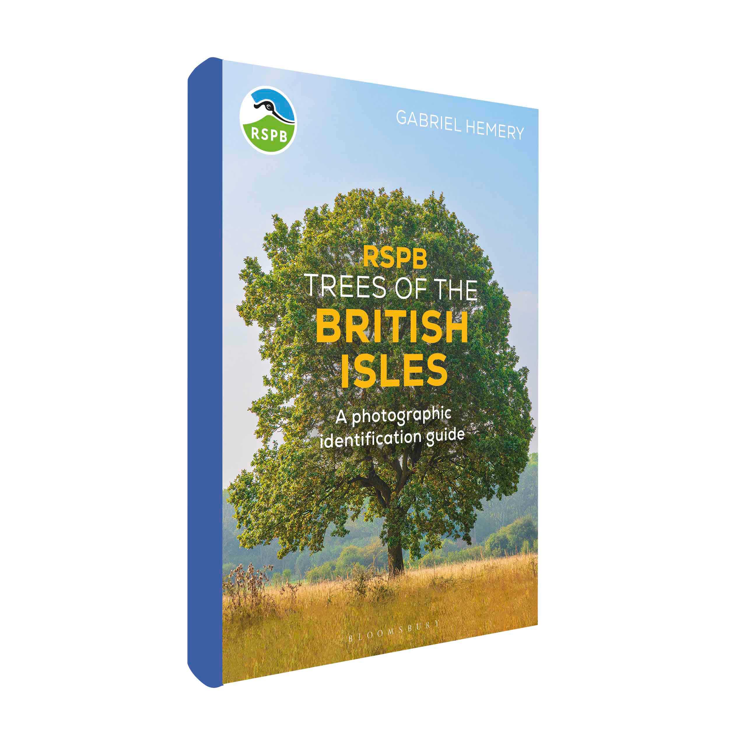 Trees of the British Isles cover, with an Oak tree in a field as the image