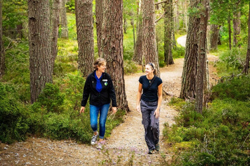 Abernethy.DSC01193 Susanna and Jess walk on a wide path through the forest