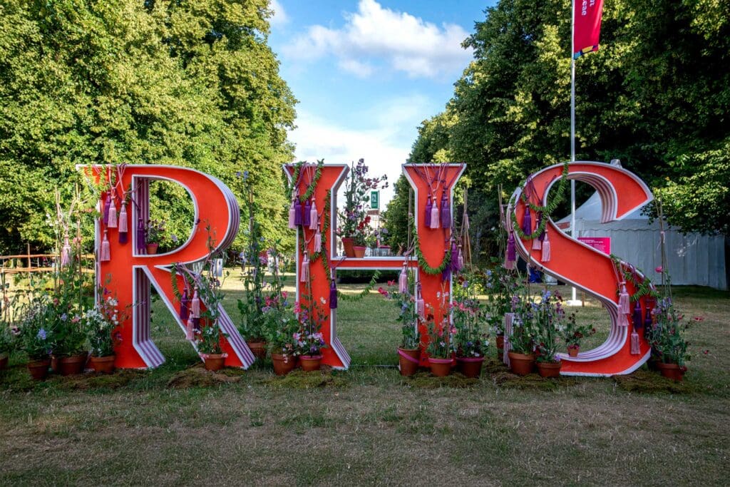 A sign for the Royal Horticultural Society, which will host a Swift garden with the RSPB at the RHS Hampton Court Palace Garden Festival.