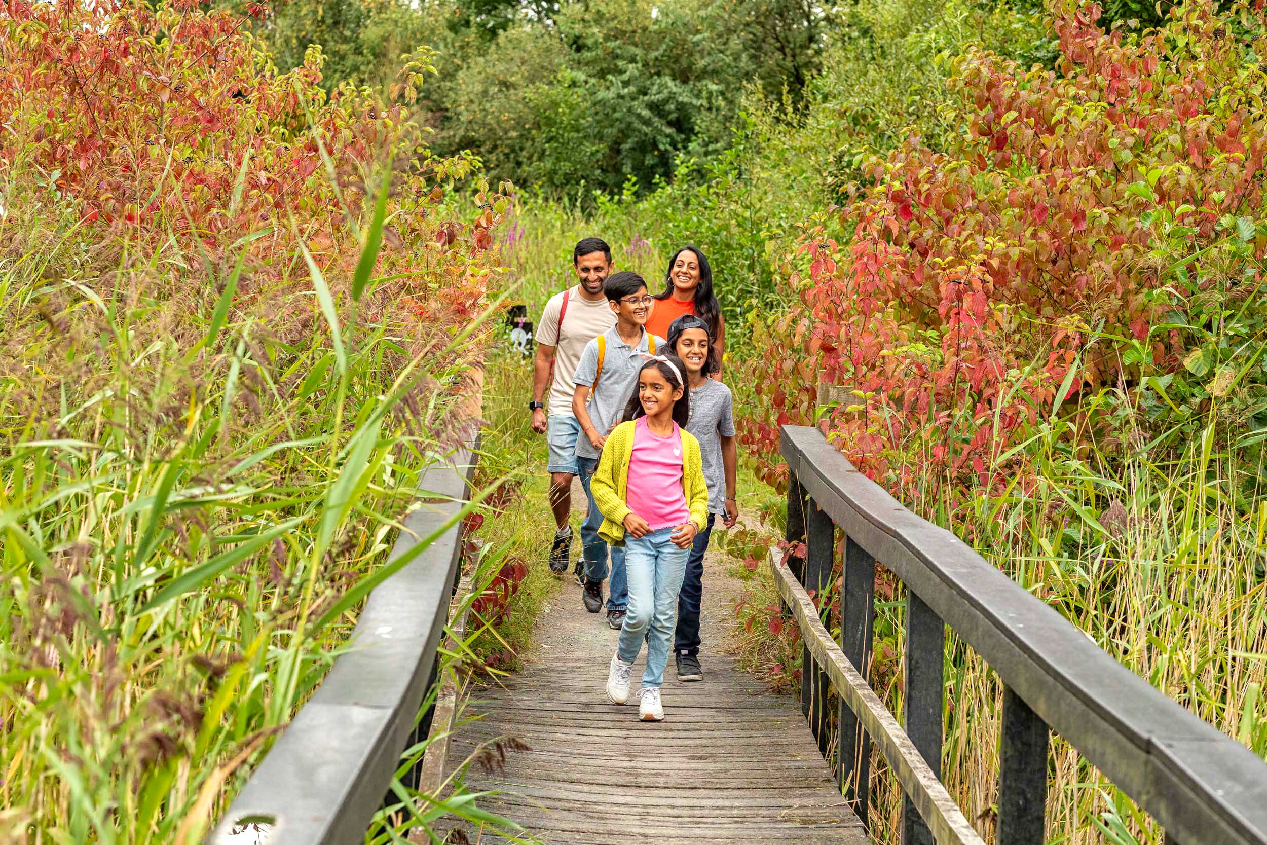 A family walking over a bridge